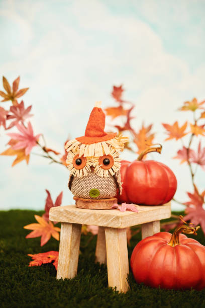 istock Cute fall arrangement with owl and pumpkins in bright setting for Thanksgiving 1420005355