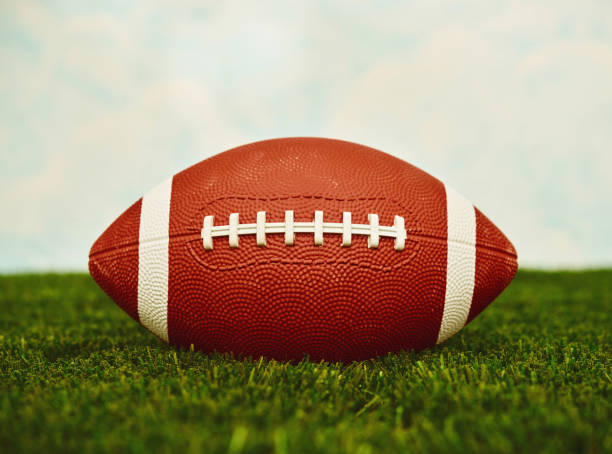 istock American football background on turf with sky and copy space 1420008140