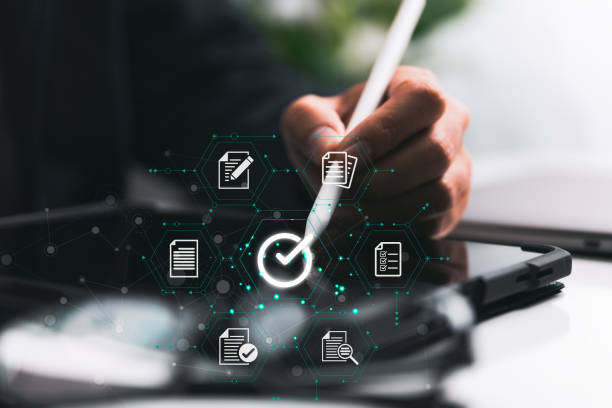 istock A businessman signs an e-document with a stylus on a digital tablet to assure quality assurance. 1420015155