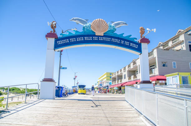Entrance gate of Wildwood boardwalk during summer day.\nIt says : \