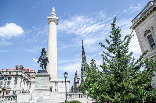 This is during summer day.\nThe Lafayette Monument is a bronze equestrian statue of Gilbert du Motier, marquis de Lafayette, by Andrew O'Connor, Jr.\n\nIt is located on the northern edge of the South Park, at Mount Vernon Place, Baltimore, directly across a cobblestone circle from The Washington Monument. It was dedicated on September 6, 1924, with President Calvin Coolidge in attendance. [1][2]\n\nThe inscription reads:\n(Sculpture, front edge, proper left side:)\nANDREW O'CONNOR\n1924\n(Sculpture, rear proper left side:)\nT. F. MCGANN & SONS CO FOUNDRY\nBOSTON MASS\n(Base, front:)