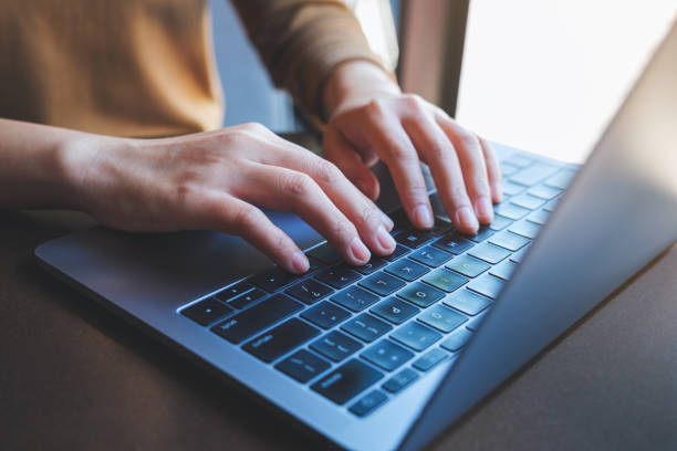 istock Closeup image of a woman working and typing on laptop computer keyboard 1420029254