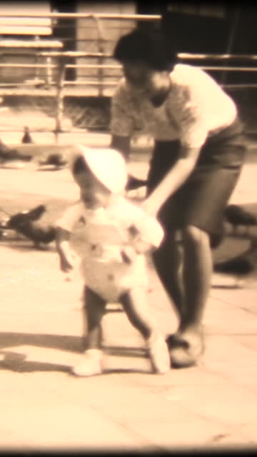 60's 8mm footage - Practice walking with help from mother