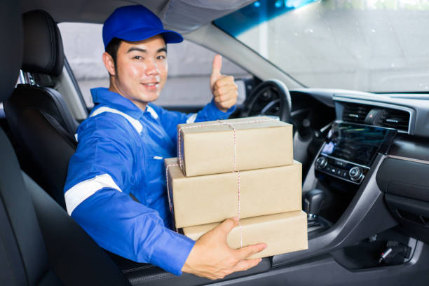 the delivery driver man driving van with parcels box on seat outside the warehouse, cargo truck delivering a package for the customer, shopping online entrepreneur  for a small startup business - mail van imagens e fotografias de stock