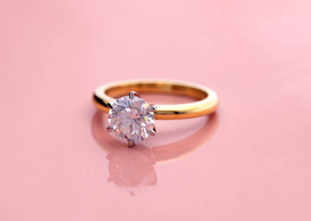 istock Luxury Engagement Diamond Ring on Pink Background 1420036107