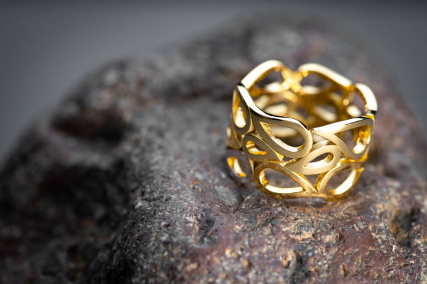 istock Luxury Gold Ring on Natural Stone 1420036304