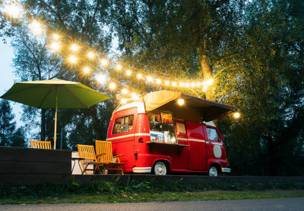 Empty small Street Food Track with an illumination standing in park.