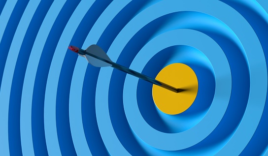 Flecha golpeando el objetivo azul amarillo liderazgo apuntando al objetivo de logro objetivo photo