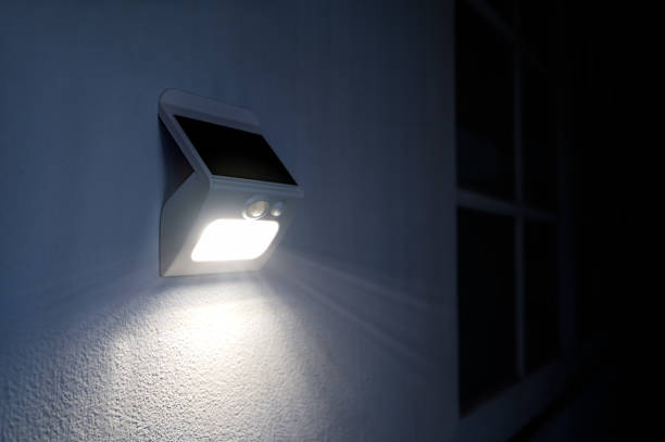 small solar powered led light with motion sensor. - motion sensor imagens e fotografias de stock