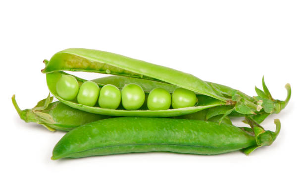 istock Fresh green peas with beans isolated on white background. Horizontal subassembly with clipping path 1420043491