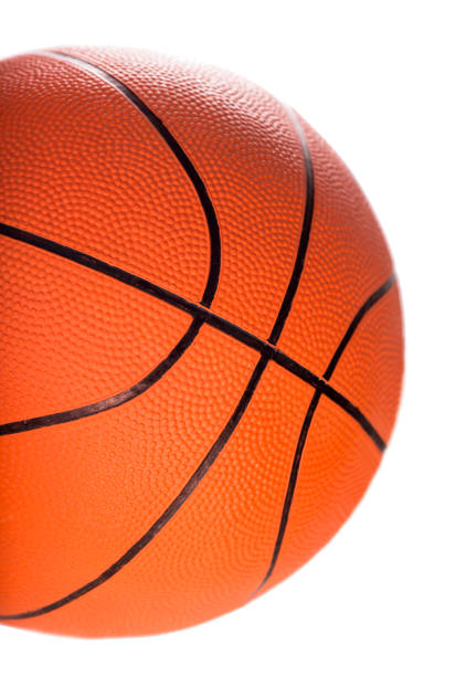 Ball for game in basketball of orange colour isolated on white background