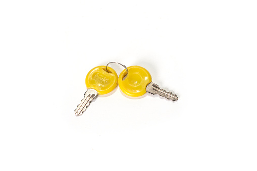 Yellow key with isolated on white background. High quality photo