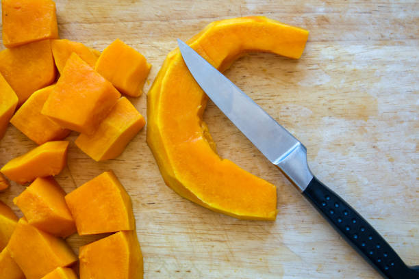 istock Pieces of pumpkin  on cutting board 1420047372