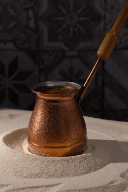 istock turkish coffee in a turk on hot sand 1420048591