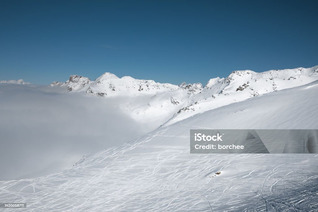 Ski Slopes Ski slopes and idyllic snowcapped mountains in Val Thorens, France. Alpine Skiing Stock Photo