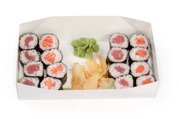 istock Different sushi with condiments in cardboard packaging for take-out 1420059008