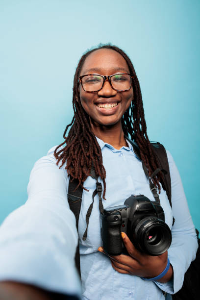 istock Professional photographer with modern DSLR being excited while taking vlog video 1420061957