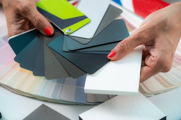istock Woman Looking at Color Palettes for Interior Decoration. 1420063340