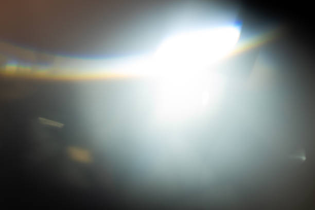 istock prism light leak texture for photo overlay and effect. lens flare in abstract background. bokeh effect with glow and magical lights on black background. 1420063659