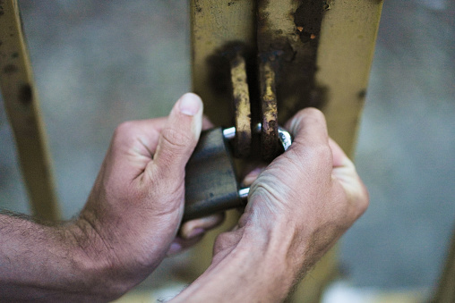 Trying to pull a lock apart with two hands