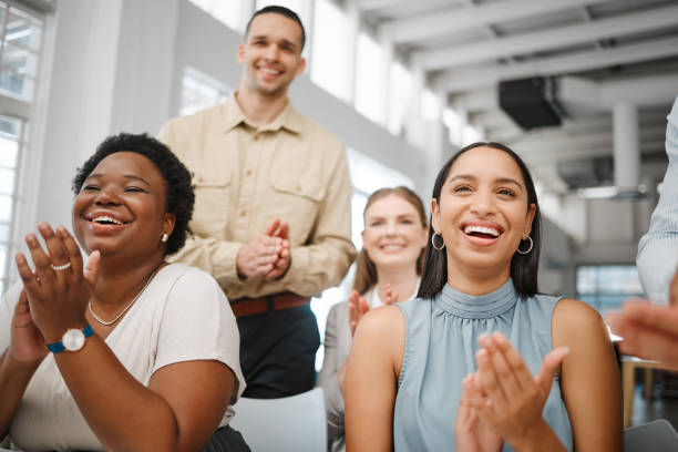 istock Clapping, celebrating and excited after training presentation, office meeting or education workshop for creative group. Diverse, cheering or motivated colleagues smiling with growth mindset or vision 1420065171