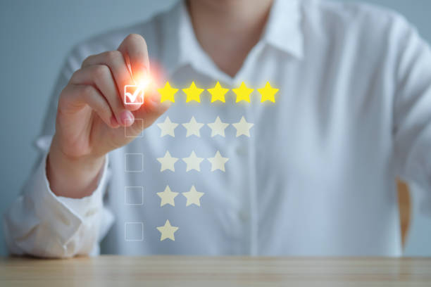 istock Customer Experience Concept. Review, increase rating or ranking, evaluation, feedback and classification concept. Businesswoman tick checkmark on checkbox for five yellow stars to rating review. 1420066329