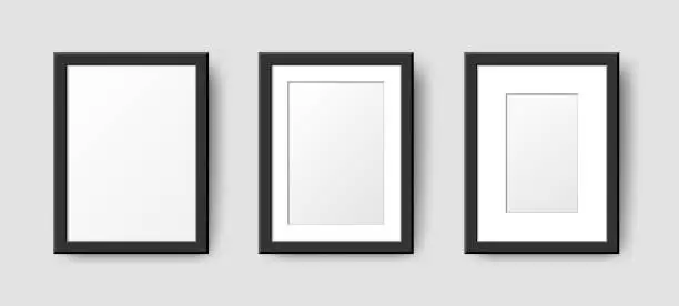 Vector illustration of Realistic Rectangle Empty Wall Photo Frames set. Vector vertical black picture frame mockup template with shadow on gray background. Mockup for poster, banner, photo gallery, painting, presentation