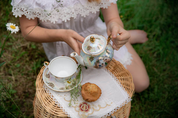 istock picnic, girl sits and drinks chamomile tea 1420067700