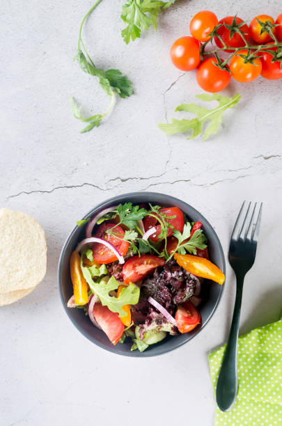 istock salad with fresh salad leaves, arugula, cherry tomato, cucomber 1420067719