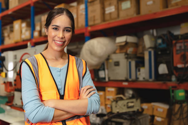 Portrait smart woman worker Asian girl teen work in warehouse factory inventory manager confident happy smiling. stock photo