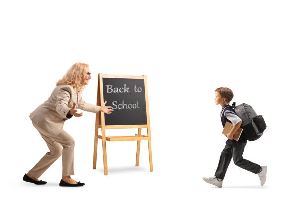 istock Teacher welcoming a schoolboy back to school 1420069900