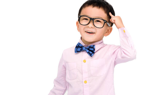 istock Smart kid standing over white background and  pointing to head with one finger 1420070145