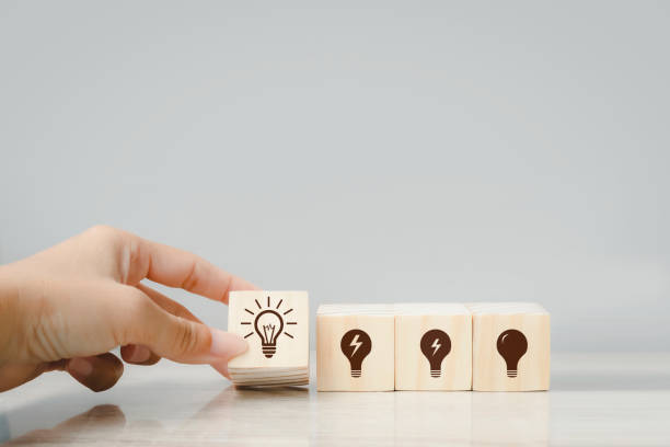 istock Hand holding stack wood cube block, idea and action plan concept project management, company strategy development. 1420071092