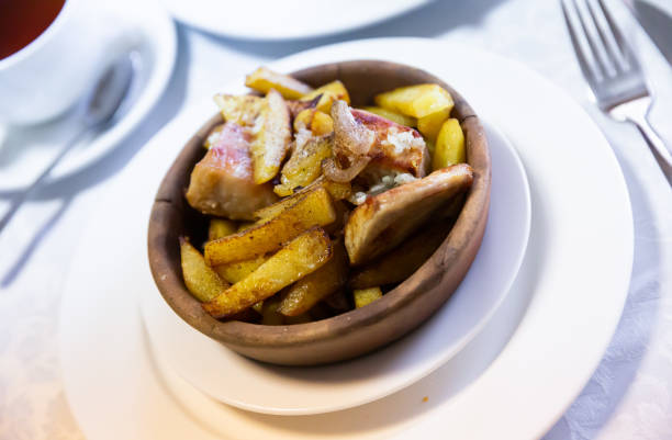 Delicious traditional Georgian meat dish Ojakhuri with potatoes and onions, fried with aromatic spices
