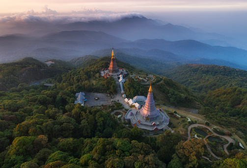 Aerial landscape sunrise view with fog over Phra Mahathat Napamonon and Phra Mahathat Naphapamsiri on the mountain at Doi Inthanon, Chiang Mai, Thailand.