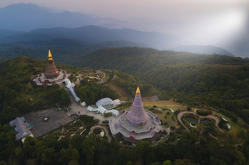 Aerial landscape sunrise view with fog over Phra Mahathat Napamonon and Phra Mahathat Naphapamsiri on the mountain at Doi Inthanon, Chiang Mai, Thailand.