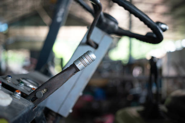 Gearshift handle lever of the forklift vehicle control panel dashboard. Transportation equipment object photo, close-up and selective focus.