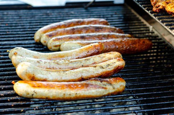 istock Grilled sausages on a cast iron grill 1420084000