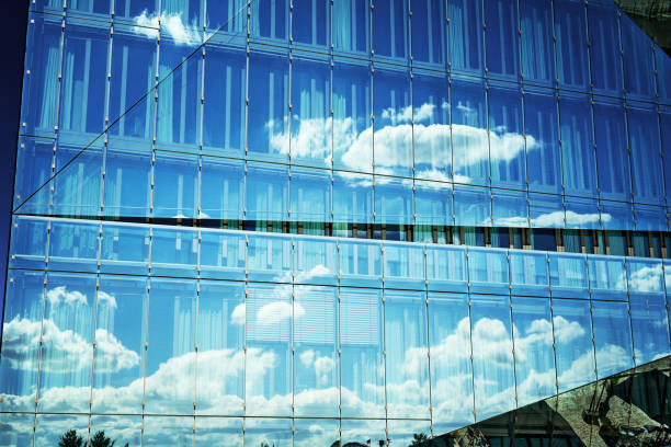 Glass Office building facade with Distorted reflections, central Berlin, Germany
