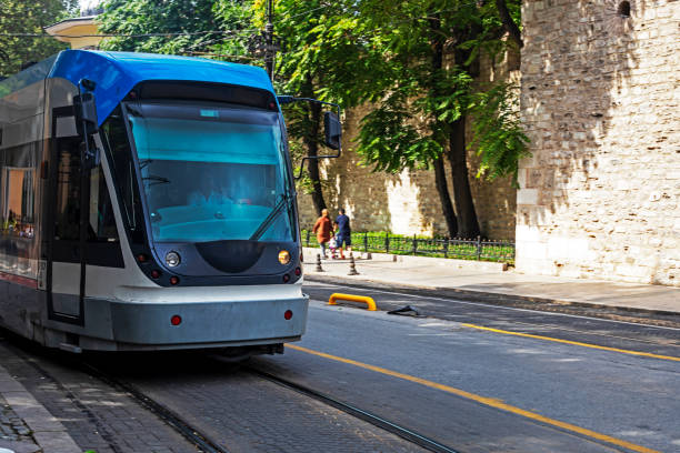 istock blue modern tram in a crowded city. travel, horizontal 1420088206