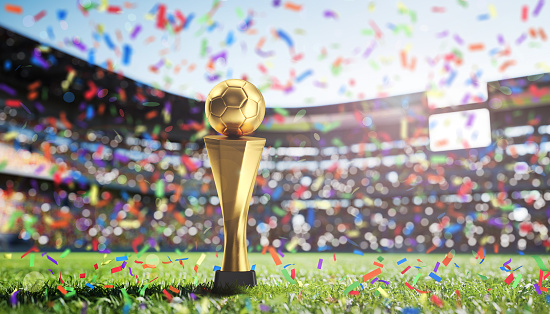 Win, field and football and trophy for sports, game award and achievement in a contest. Fitness, grass and a prize or reward for soccer competition, championship or celebration of a goal at a stadium