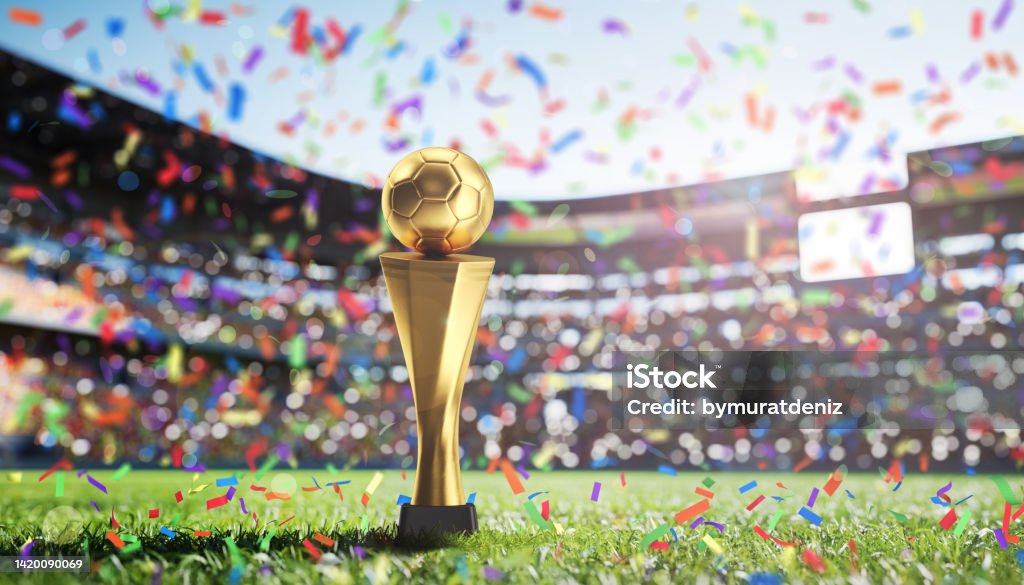 Golden Cup in football stadium International Soccer Event Stock Photo