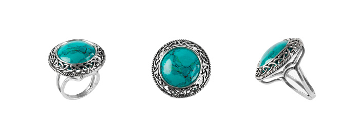 Ring with diamonds and turquoise diamond on white background.