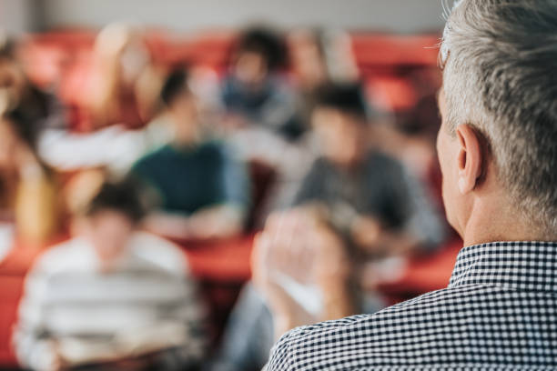 istock Close up of a male teacher giving a lecture on a class. 1420092079