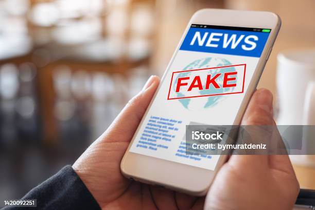 Fake News On Smartphone Stock Photo - Download Image Now - Fake News, Online Trolling, Social Media