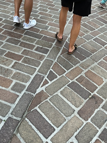 Legs of a young couple on a street