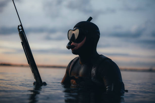 istock Man spearfishing with a speargun 1420096244