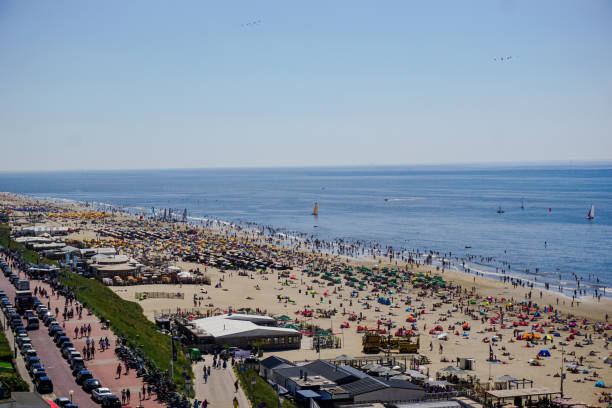 istock high angle view of people at beach against clear sky 1420096788