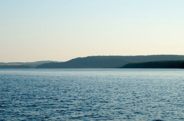 istock River water landscape. Forest trees on the background 1420098241