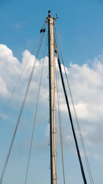 Sailship mast on a cloudy sky